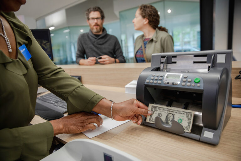Bank Teller Helping Customer