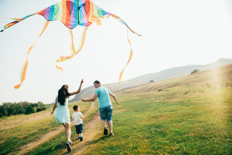 Family Flying Kite Outdoors