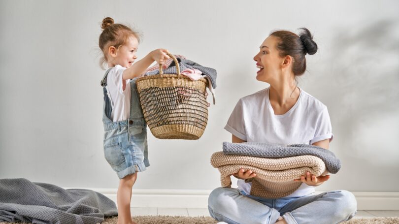 Mom Daughter Doing Laundry Together