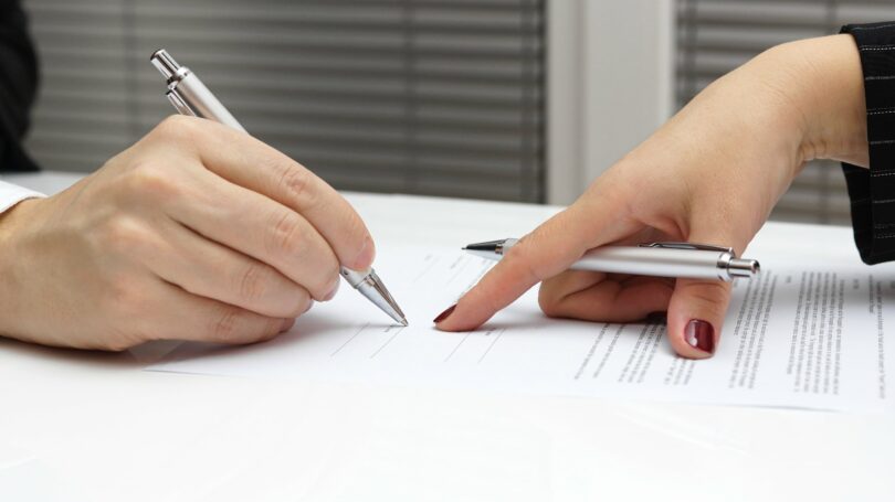 Pointing To Signature Contract Legal Documents Files Paperwork