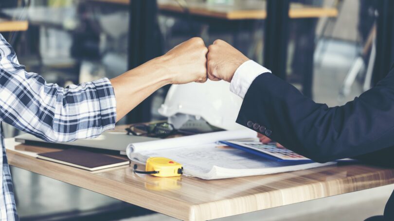 Business Partner Fist Pump Restaurant Table