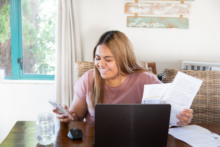 Woman Desk Computer Holding Phone Papers