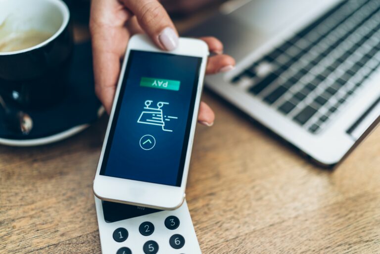 Hand Holding Mobile Phone Payment App